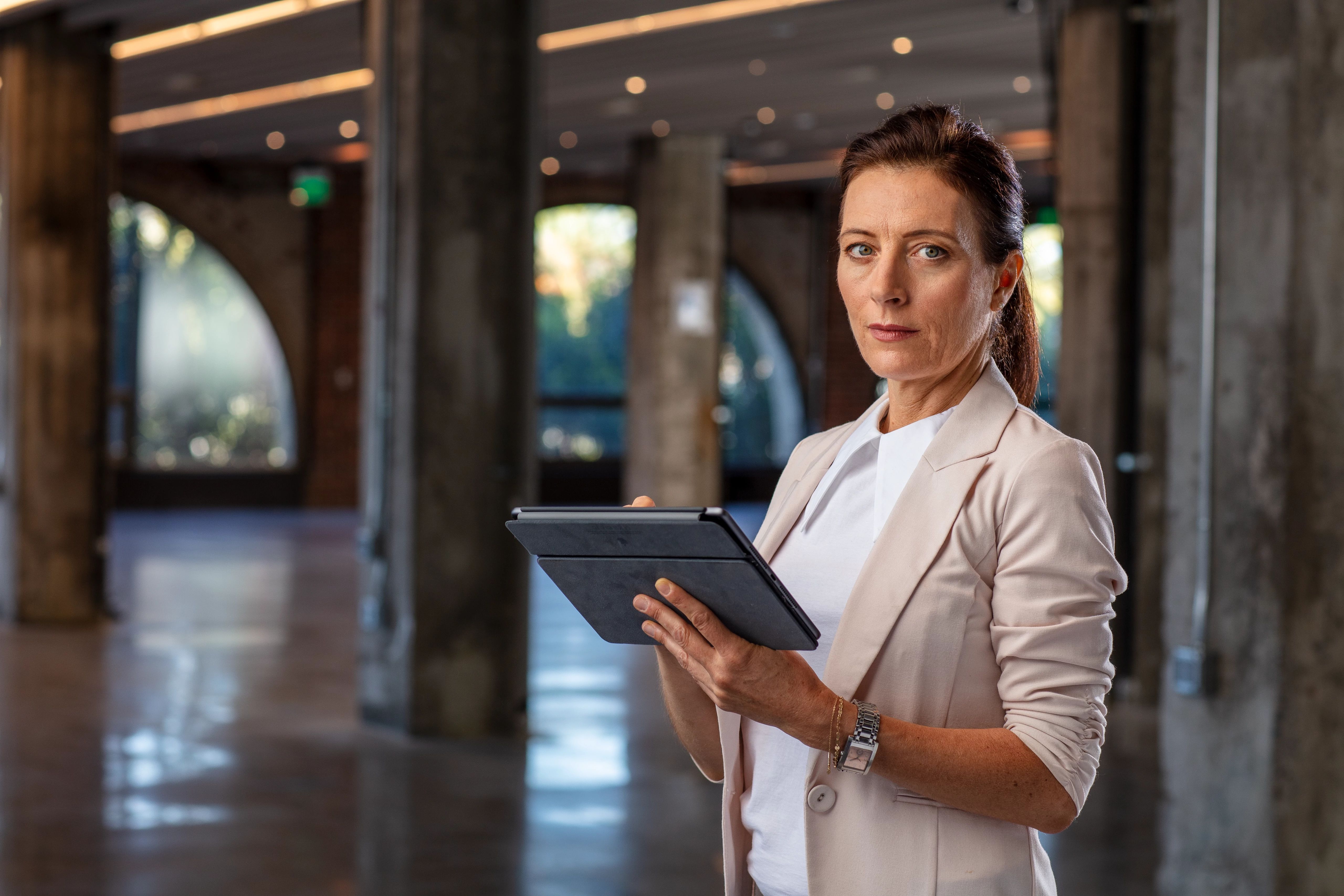 Woman standing with iPad