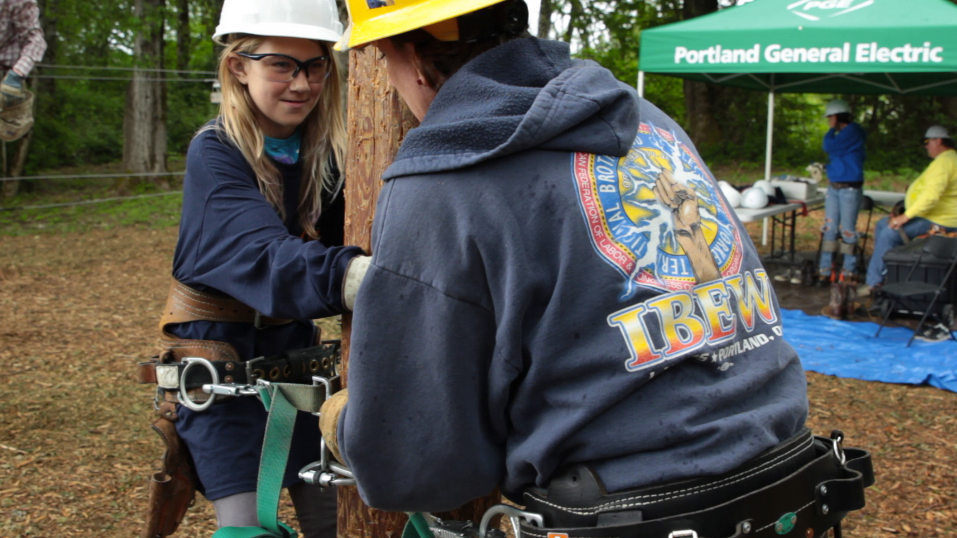 Tradeswoman with young girl