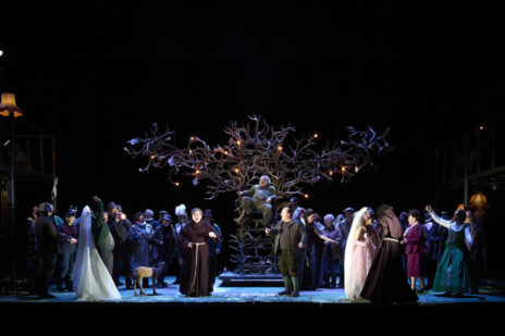 Stage with large ensemble and throne made of deer antlers.