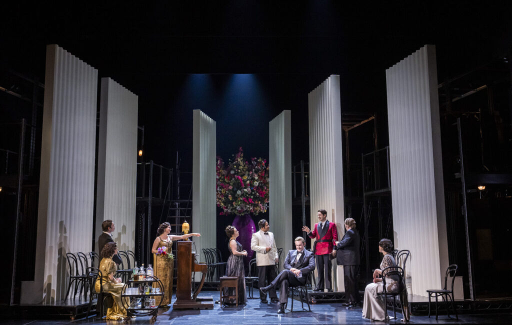 Opera singers on a stage with large white panels