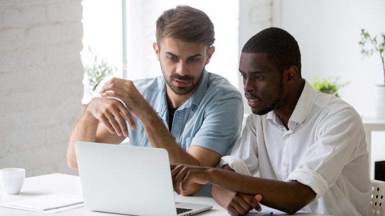 Two men learning construction technology, Autodesk Construction Cloud