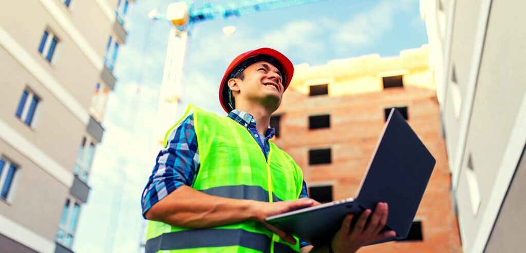 Construction worker using document management software in the field