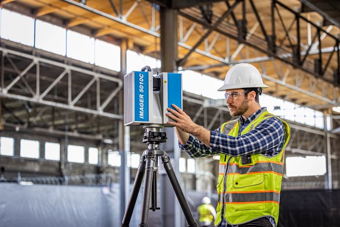 construction engineer surveys jobsite