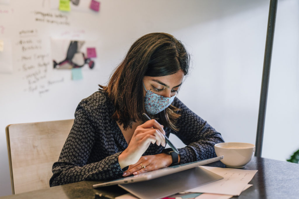 remote-worker-wearing-mask-tablet