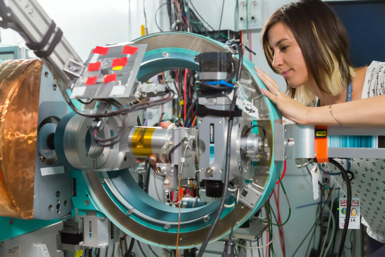 Scientist adjusting instrumentation of device
﻿